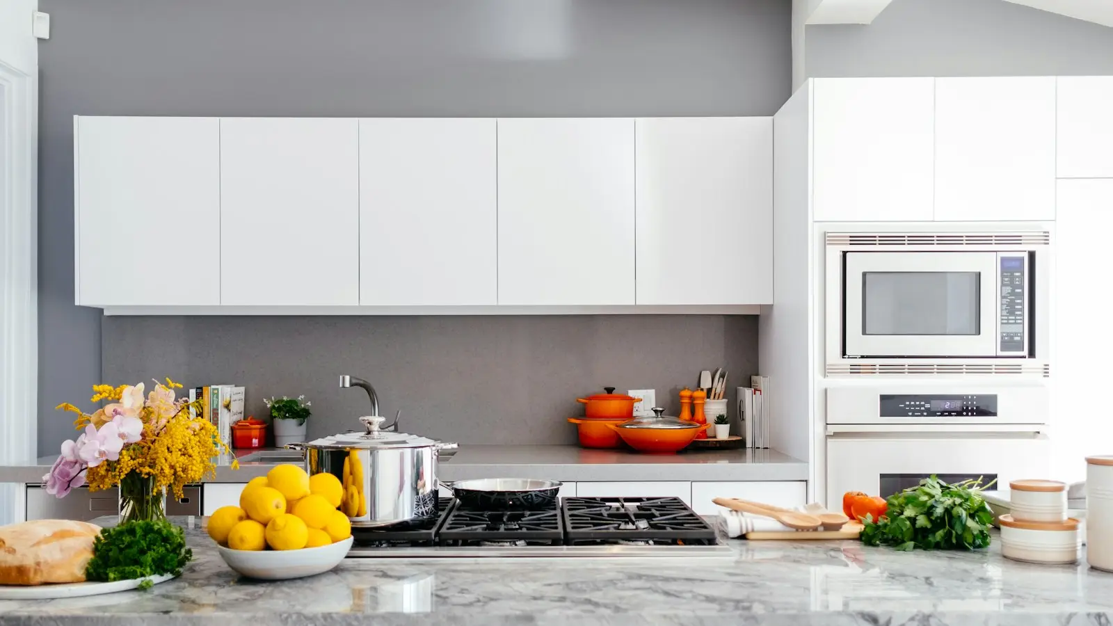 Bright white kitchen with a smooth splashback behind the benchtop