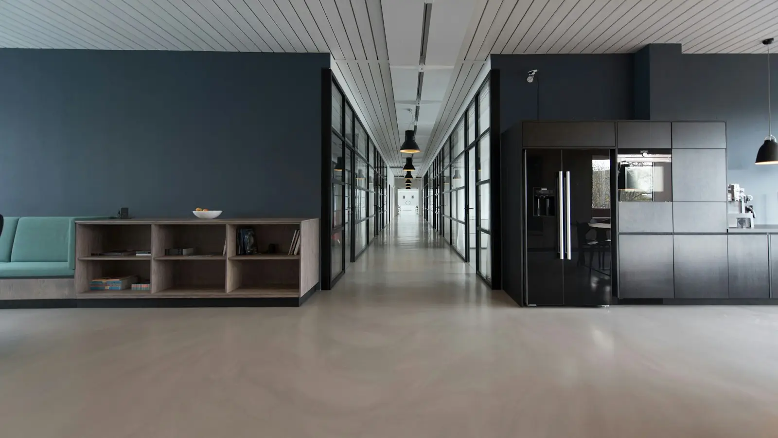 Bright, tidy open-plan office with clear desks and polished floors