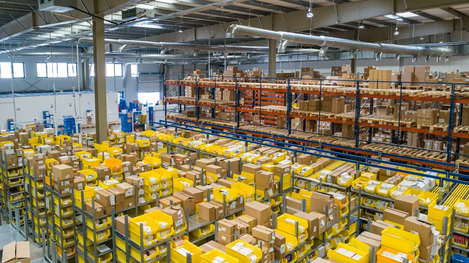 Large, tidy warehouse floor with stock on racking