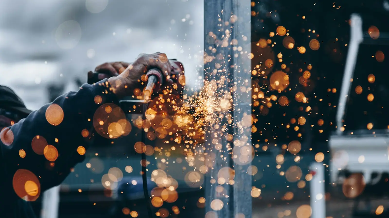 Industrial workshop with sparks from metal work